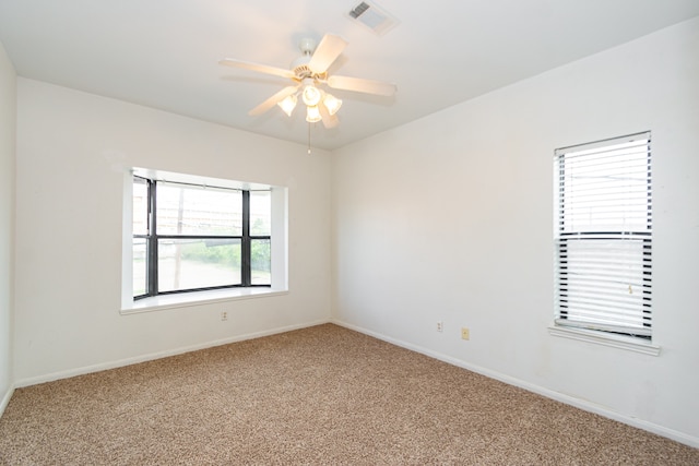 unfurnished room with ceiling fan and carpet flooring