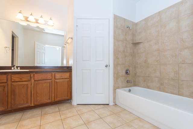 bathroom with vanity, tile patterned flooring, and tiled shower / bath