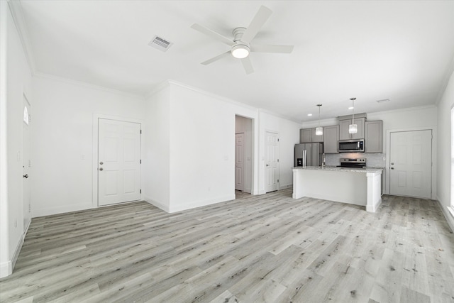 unfurnished living room featuring ornamental molding, light hardwood / wood-style floors, and ceiling fan