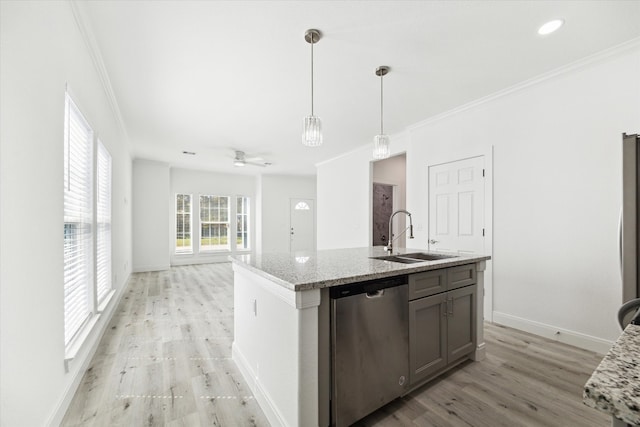 kitchen with sink, ornamental molding, light wood-type flooring, pendant lighting, and dishwasher