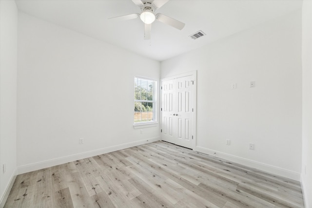 spare room with ceiling fan and light hardwood / wood-style flooring