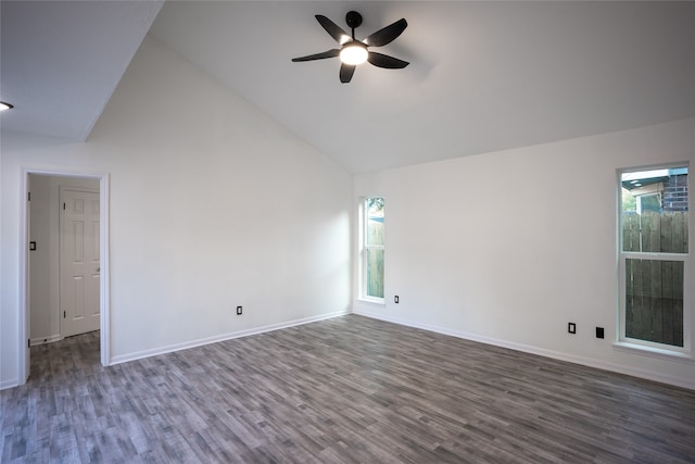 empty room with high vaulted ceiling, dark hardwood / wood-style flooring, and ceiling fan