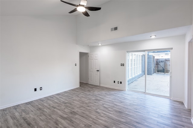 unfurnished room with ceiling fan, light hardwood / wood-style flooring, and high vaulted ceiling