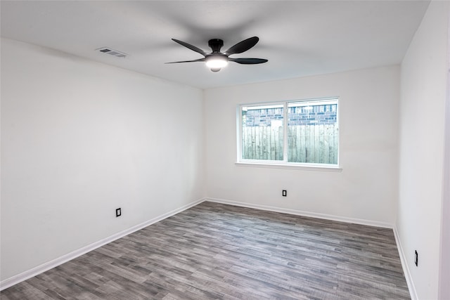 unfurnished room with hardwood / wood-style flooring and ceiling fan