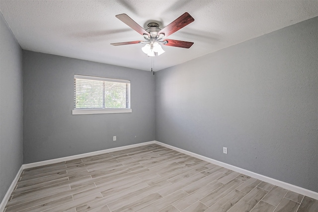 unfurnished room featuring a textured ceiling, ceiling fan, and light hardwood / wood-style flooring