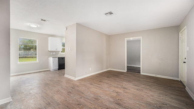 unfurnished living room featuring hardwood / wood-style floors