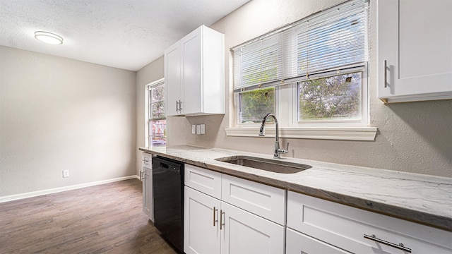 kitchen featuring sink, light stone countertops, white cabinets, dark wood-type flooring, and dishwasher