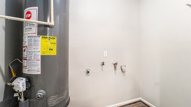 utility room featuring gas water heater