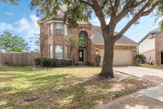 view of front facade with a garage and a front lawn