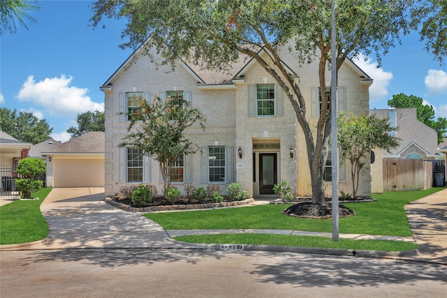 view of front of home featuring a garage and a front lawn