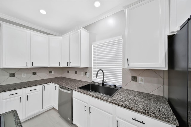 kitchen featuring sink, dishwasher, refrigerator, dark stone countertops, and white cabinets