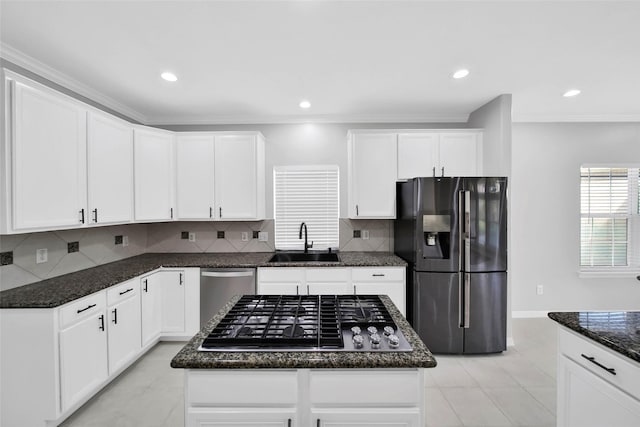 kitchen featuring sink, gas cooktop, a center island, black fridge, and stainless steel dishwasher