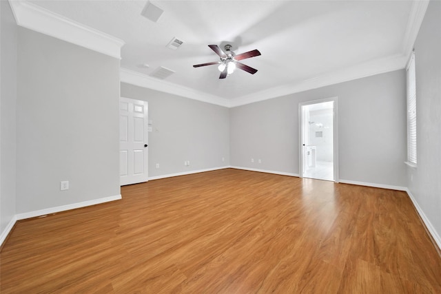 unfurnished room with ornamental molding, ceiling fan, and light wood-type flooring