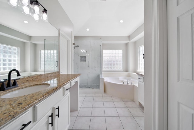 bathroom featuring vanity, separate shower and tub, and tile patterned flooring