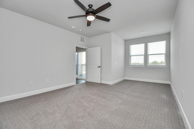 6804 Westview Dr Unit 3405, Houston, TX 77055 - spare room with dark carpet, a ceiling fan, and baseboards