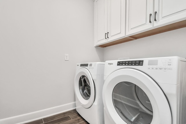 6804 Westview Dr Unit 3405, Houston, TX 77055 - washroom with cabinet space, washer and clothes dryer, baseboards, and dark wood finished floors