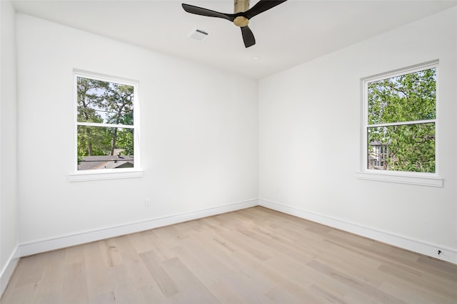 unfurnished room with ceiling fan and light hardwood / wood-style flooring