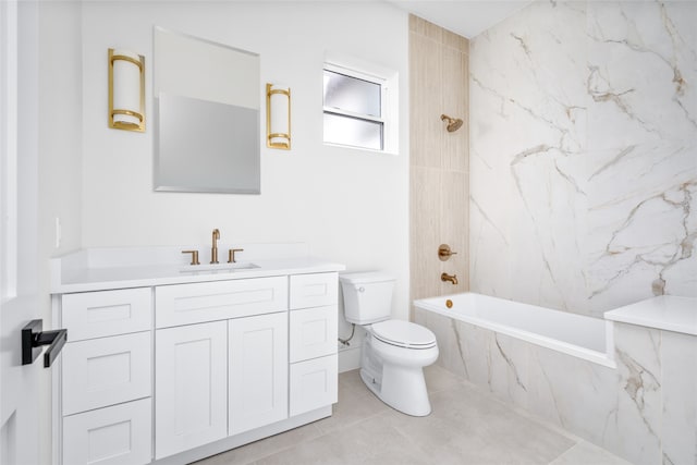 full bathroom featuring toilet, vanity, tiled shower / bath, and tile patterned flooring