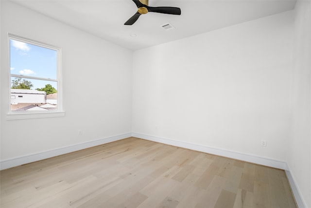 empty room with light hardwood / wood-style floors and ceiling fan