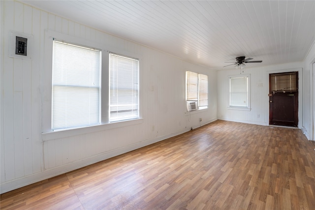 unfurnished living room with cooling unit, wood-type flooring, wooden ceiling, and ceiling fan