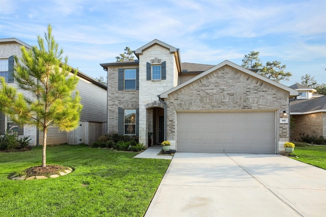 view of front of property with a garage and a front yard