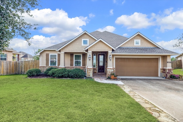 craftsman-style home with a front yard and a garage