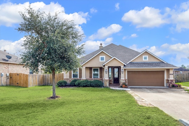 view of front facade with a front yard and a garage