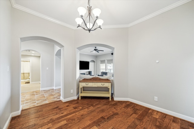 hallway featuring ornamental molding, a chandelier, and hardwood / wood-style flooring