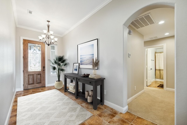 foyer with light colored carpet, crown molding, and an inviting chandelier