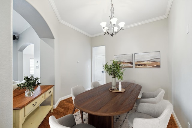 dining room with a chandelier, dark hardwood / wood-style floors, and ornamental molding