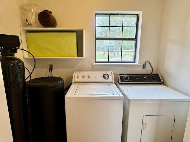 clothes washing area featuring washing machine and dryer