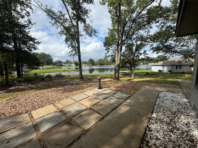 view of patio featuring a water view