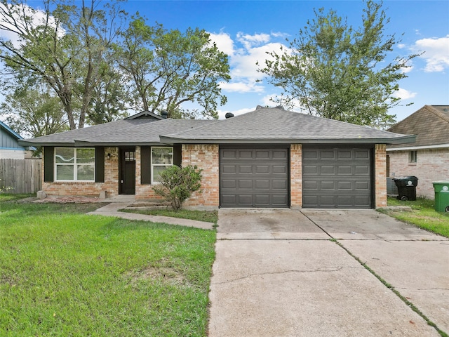 single story home featuring a garage and a front yard