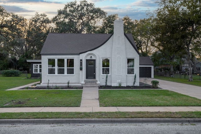 view of front of house with a lawn