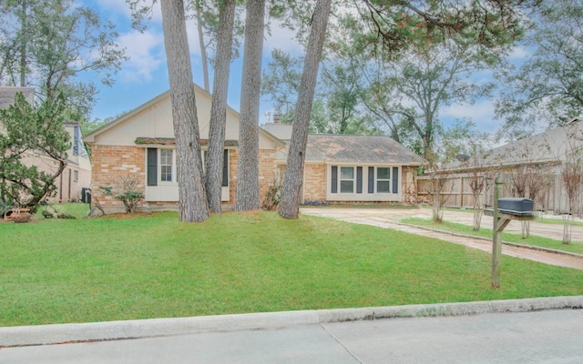 ranch-style house with a front yard