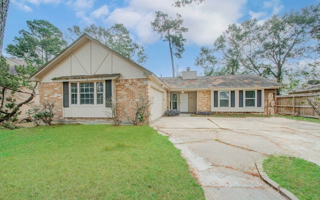 view of front of home with a front lawn and a garage