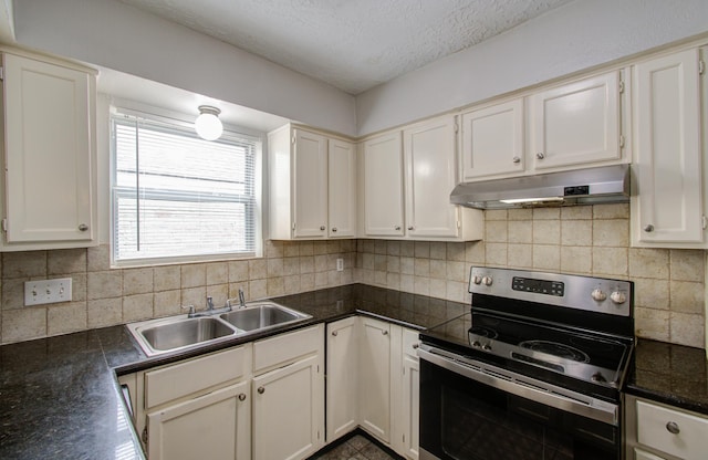2046 Lexington Woods Dr, Spring, TX 77373 - kitchen featuring stainless steel range with electric cooktop, under cabinet range hood, a sink, a textured ceiling, and dark countertops