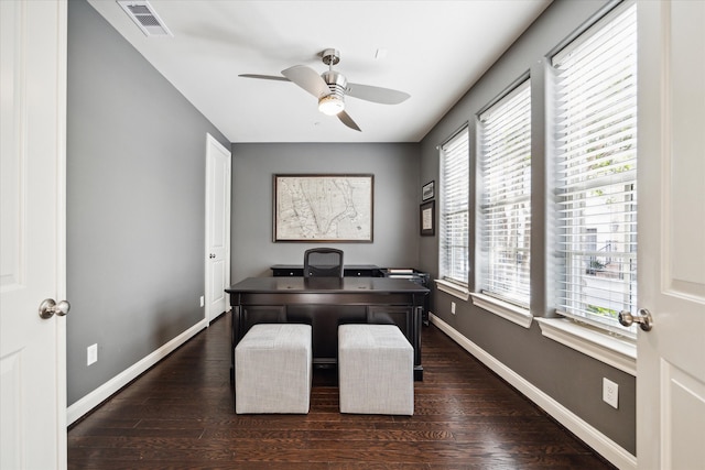 office space featuring ceiling fan, dark hardwood / wood-style floors, and a healthy amount of sunlight