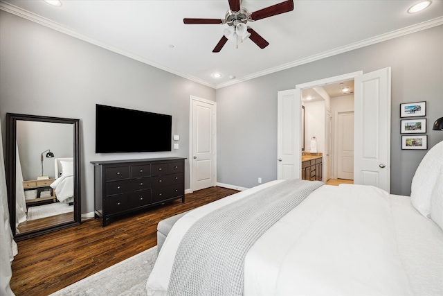 bedroom with crown molding, ensuite bathroom, dark hardwood / wood-style floors, and ceiling fan