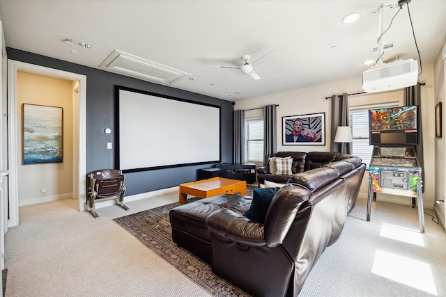 carpeted cinema with a wall unit AC and ceiling fan