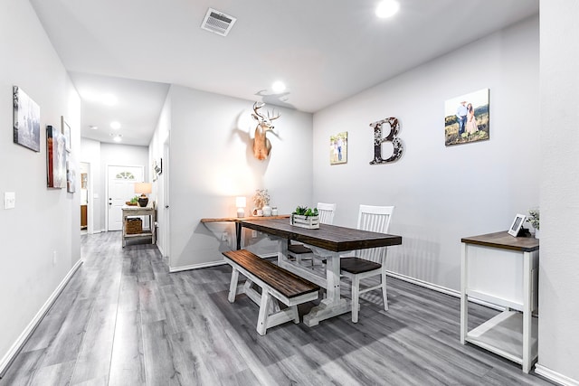 dining space featuring hardwood / wood-style floors