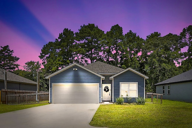 single story home with a garage and a lawn