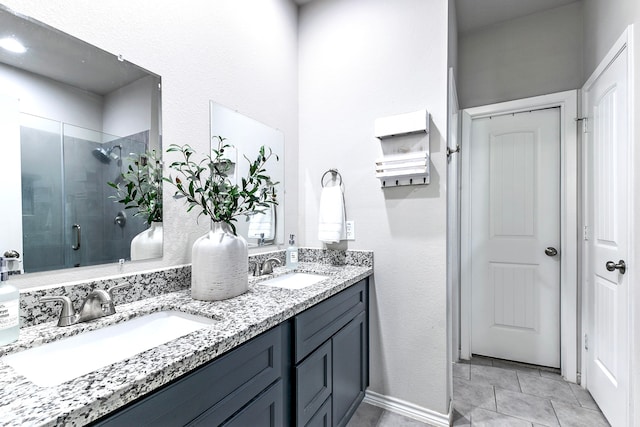 bathroom with vanity, tile patterned floors, and an enclosed shower