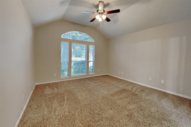 carpeted spare room with lofted ceiling and ceiling fan