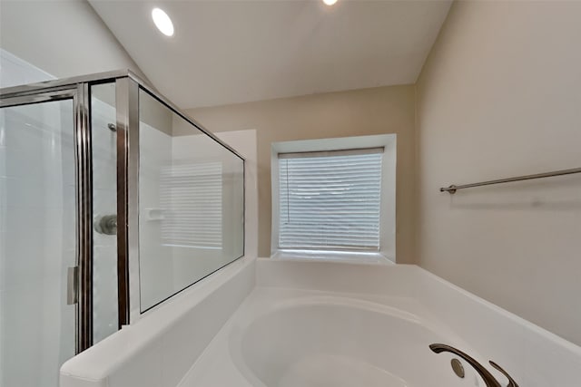 bathroom with separate shower and tub