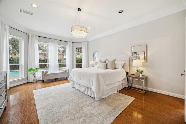 bedroom featuring dark wood-style floors, baseboards, visible vents, and recessed lighting