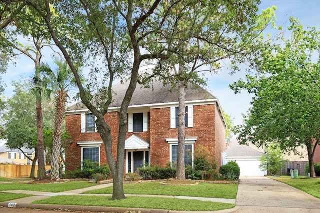 view of front facade featuring a garage and a front yard