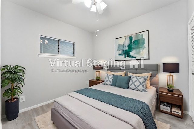 bedroom featuring light hardwood / wood-style flooring and ceiling fan