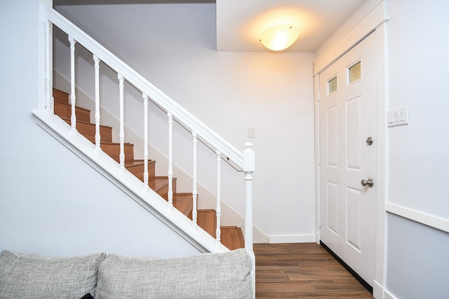 foyer entrance with dark wood-type flooring