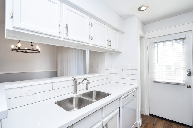 kitchen featuring dishwasher, white cabinetry, sink, and dark hardwood / wood-style floors